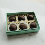 Box of chocolates on a marble surface