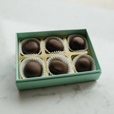 Box of chocolates on a marble surface